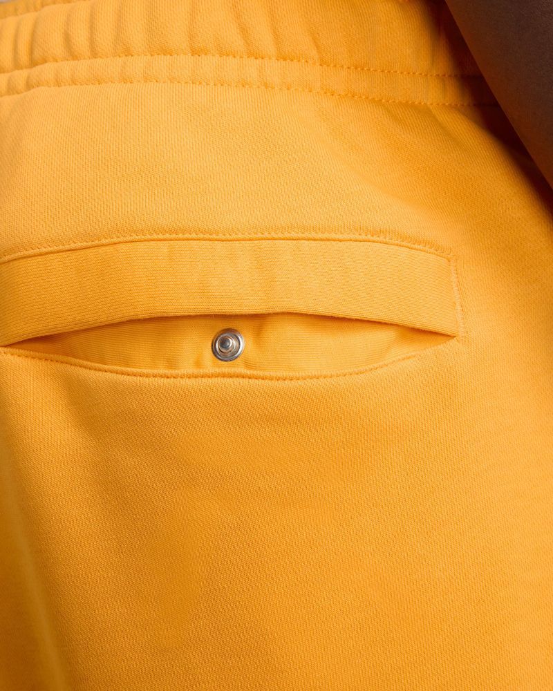Nike nsw yellow pants hotsell