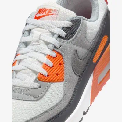 Grey orange nike shoes deals